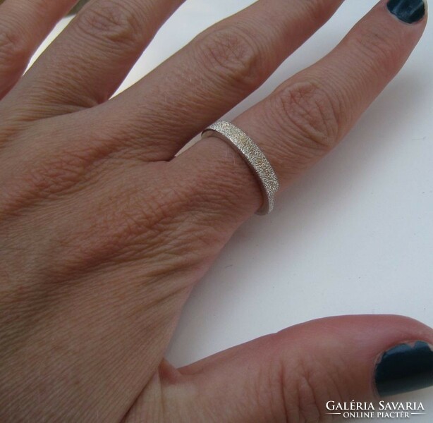 Silver fossil ring with a shiny surface