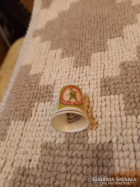 Interesting old porcelain thimble (huntley&palmers ginger nuts)