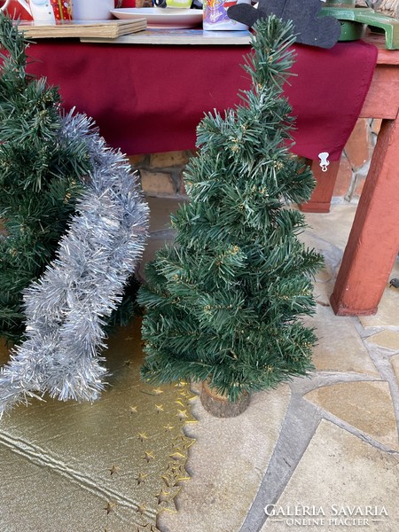 On a wooden base, artificial pine trees, pine trees, Christmas trees