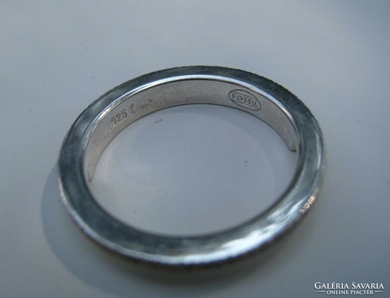 Silver fossil ring with a shiny surface