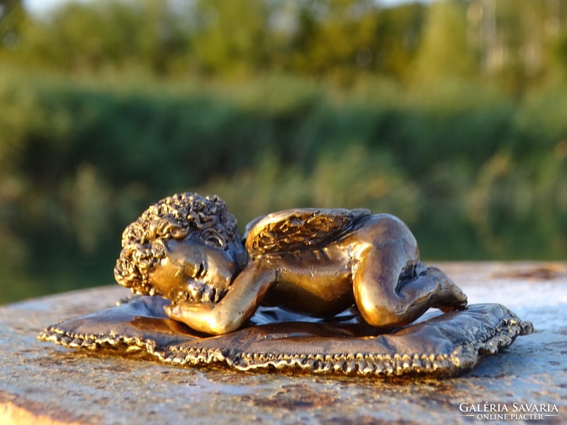 Resting angel bronze statue