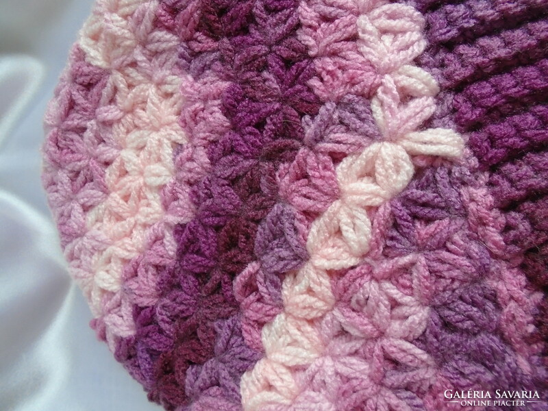 Crocheted, handmade hat with 2 tassels.