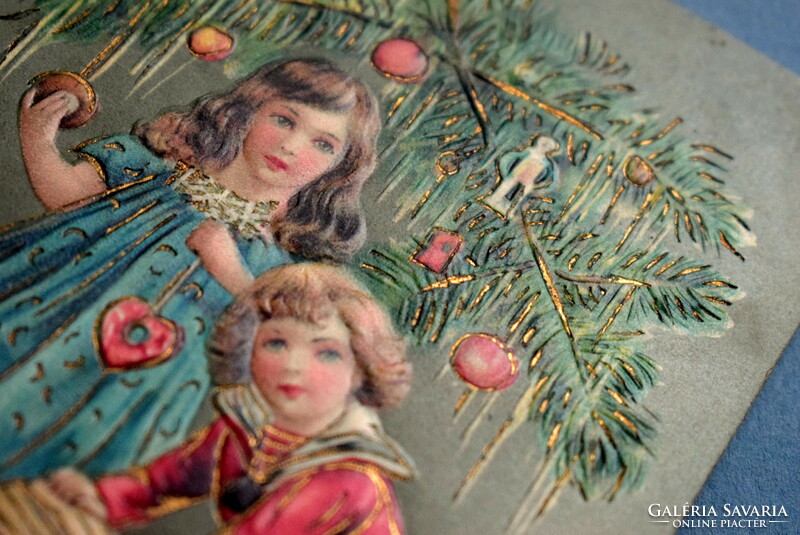 Antique embossed Christmas greeting card - little girl, little boy decorating a Christmas tree from 1912