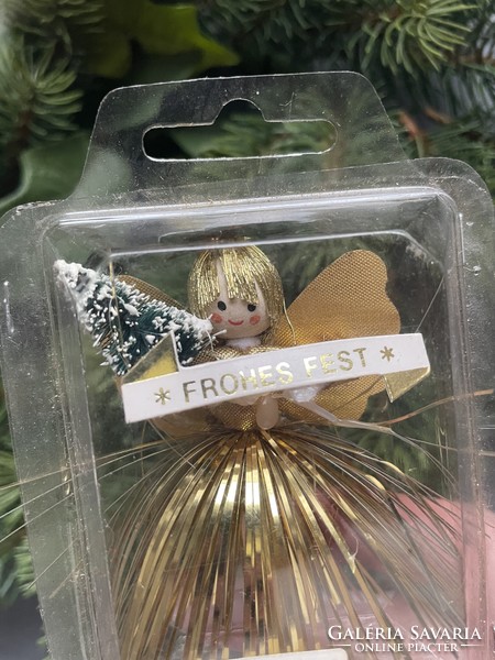 Angel girl in gold dress Christmas tree decoration - holding Christmas tree