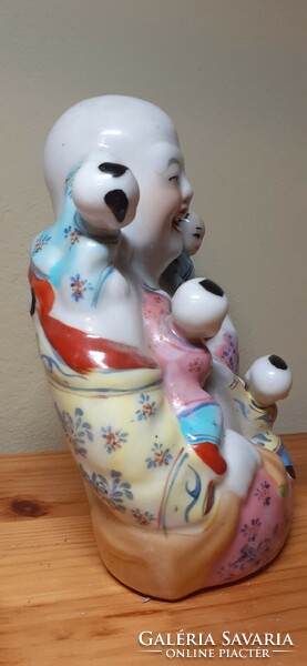 Laughing Buddha porcelain statue - lucky charm