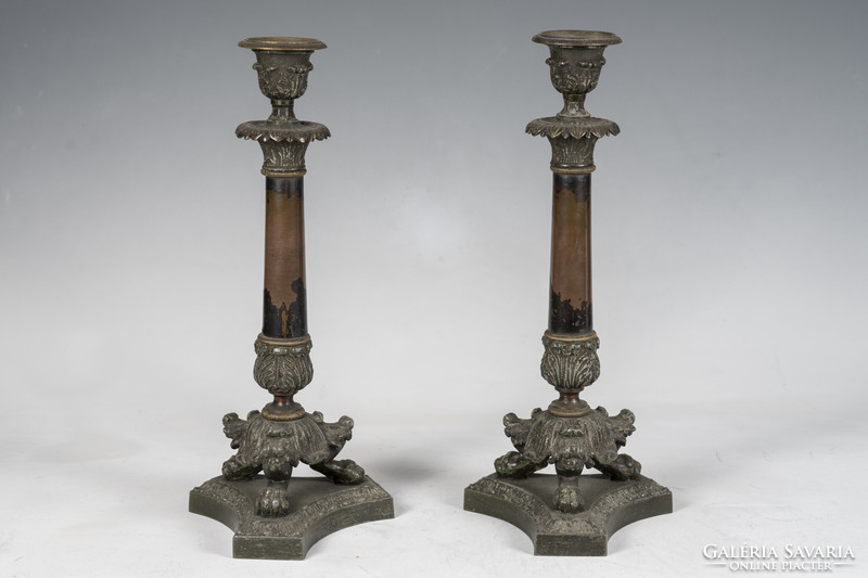 Pair of bronze candlesticks with stylized lion feet