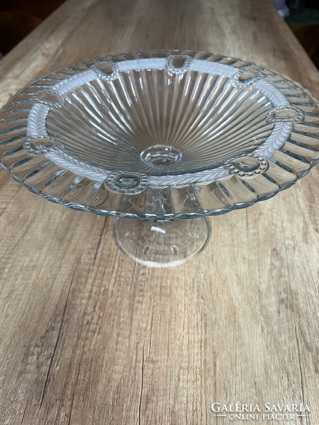 A huge glass bowl with a base