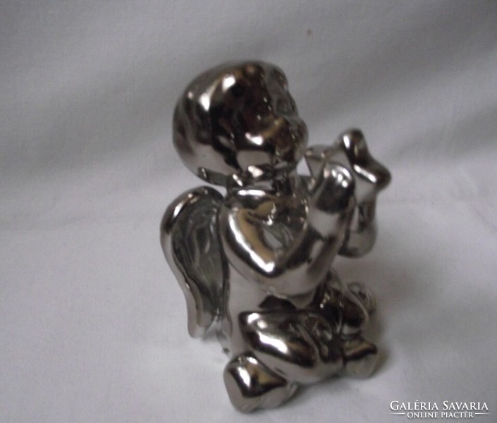 Silver colored angel, putto, Christmas table decoration, star