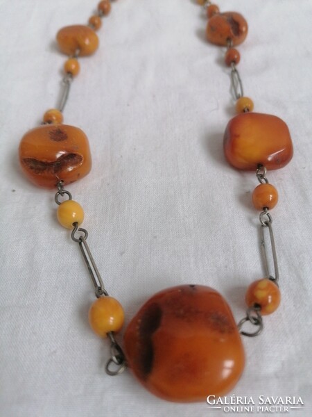 Amber necklace with metal fittings.
