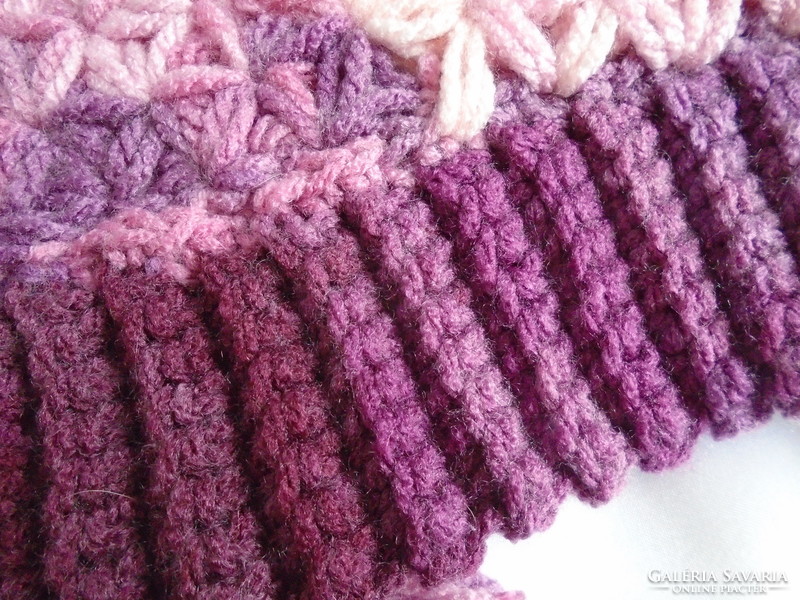 Crocheted, handmade hat with 2 tassels.