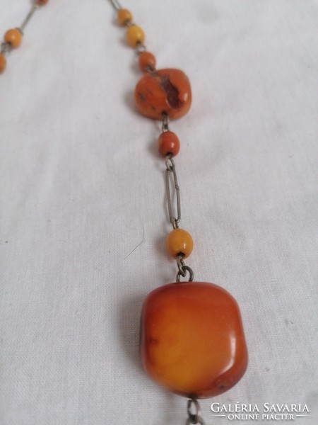 Amber necklace with metal fittings.