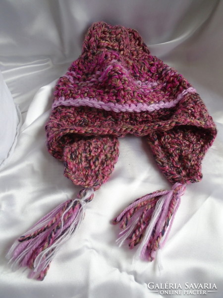 Handmade cap with crocheted tassels.