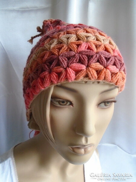 Handmade crocheted hat with long tassels.
