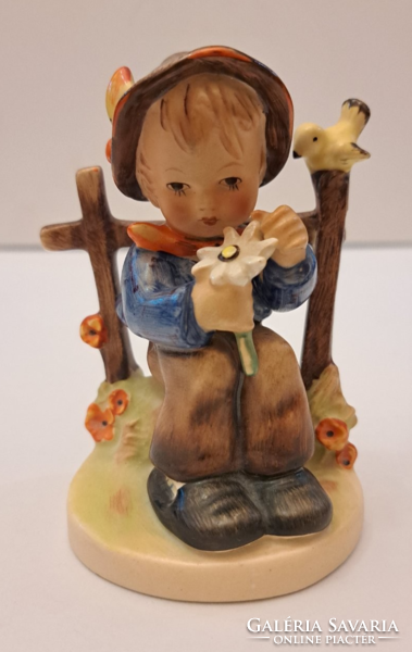 Antique hummel porcelain figurine of a boy with flowers