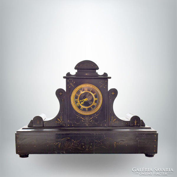 French fireplace mantel clock, stone case decorated with engraved gilding