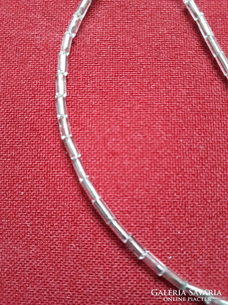 Necklace made of elongated beads