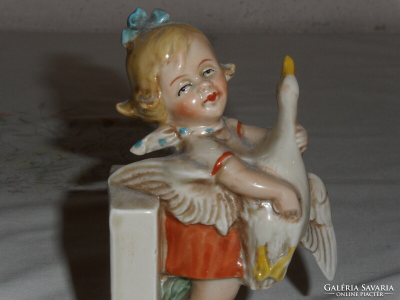 Antique, old German porcelain figurine, nipple, book support