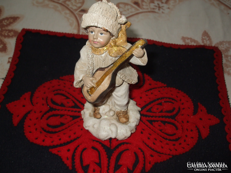 Old, beautifully crafted lifelike little boy with a guitar Material: synthetic resin Height: 15 cm