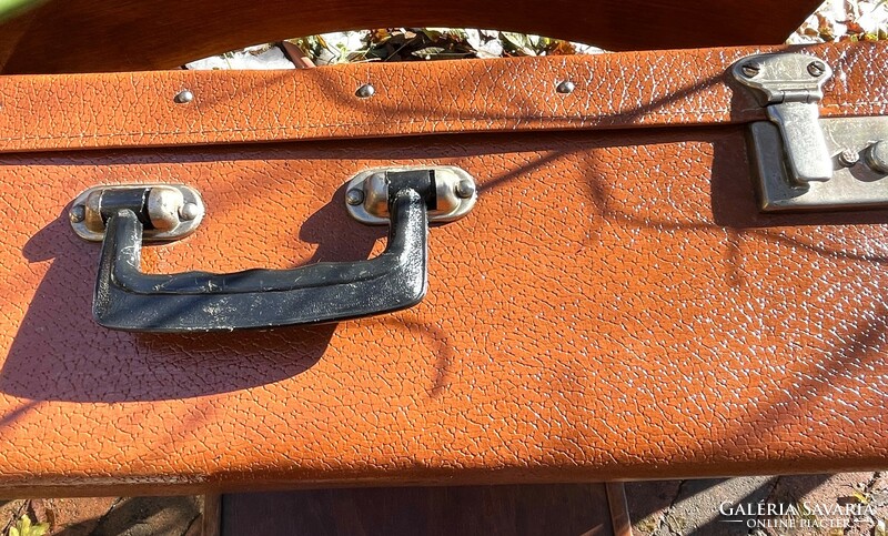 Old metal buckled, large, brown suitcase with manufacturer's mark, retro suitcase