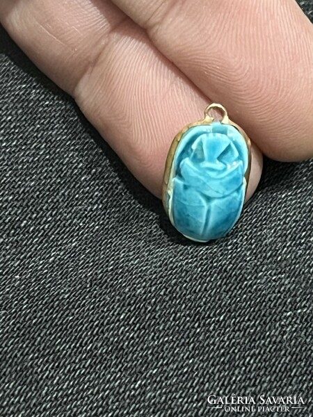 Gold pendant with turquoise stone