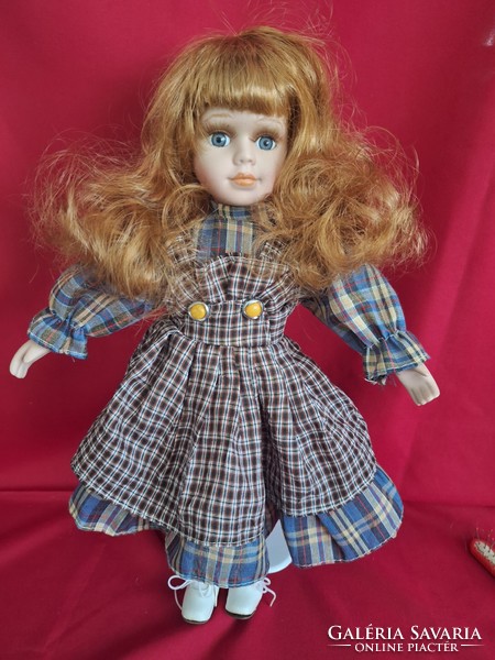 Porcelain doll, combable, dressable, with stand