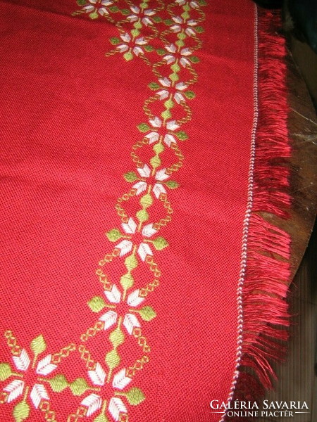 Beautiful hand-embroidered woven tablecloth with fringed edges