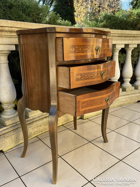 Old graceful three-drawer chest of drawers