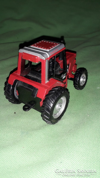 Red metal / plastic flywheel tractor in very nice condition, nice and working condition according to the pictures
