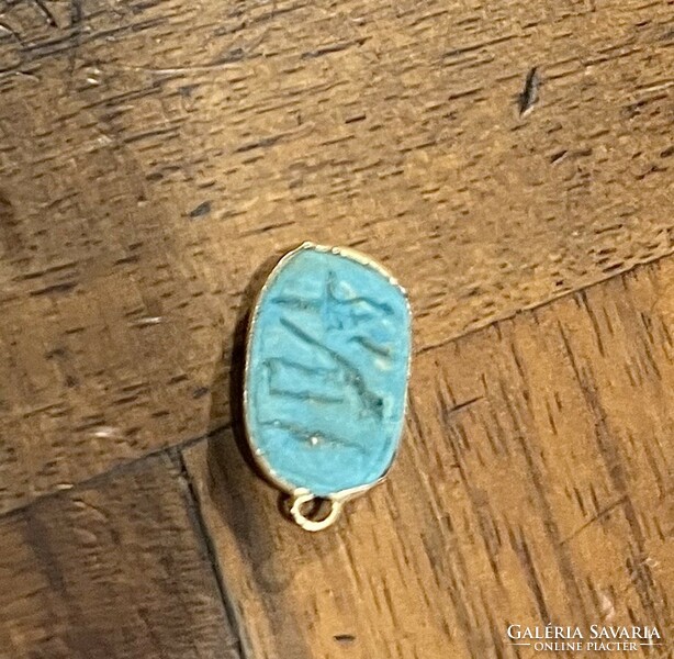 Gold pendant with turquoise stone