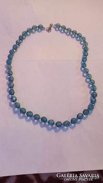 Vintage women's necklace, jewelry strung with minimal iridescent blue eyes