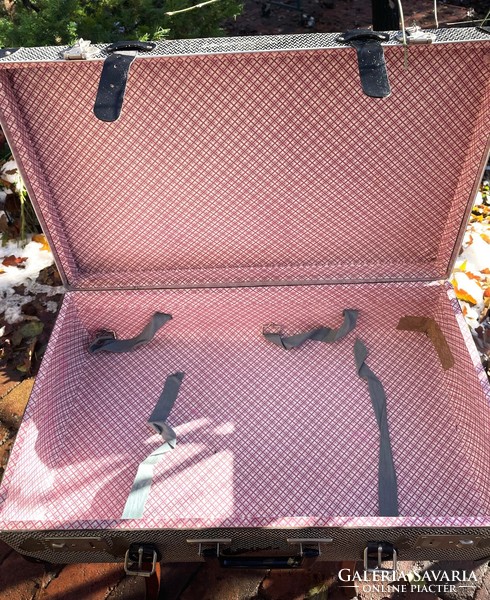 Old herringbone patterned black and white large strap suitcase, retro suitcase