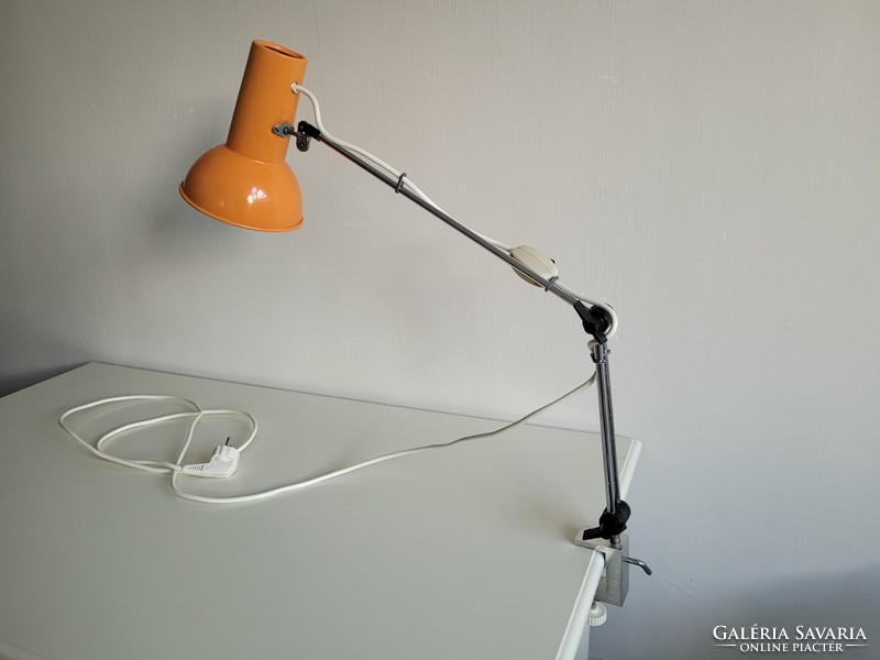 Orange colored old retro long arm adjustable desk lamp mid century