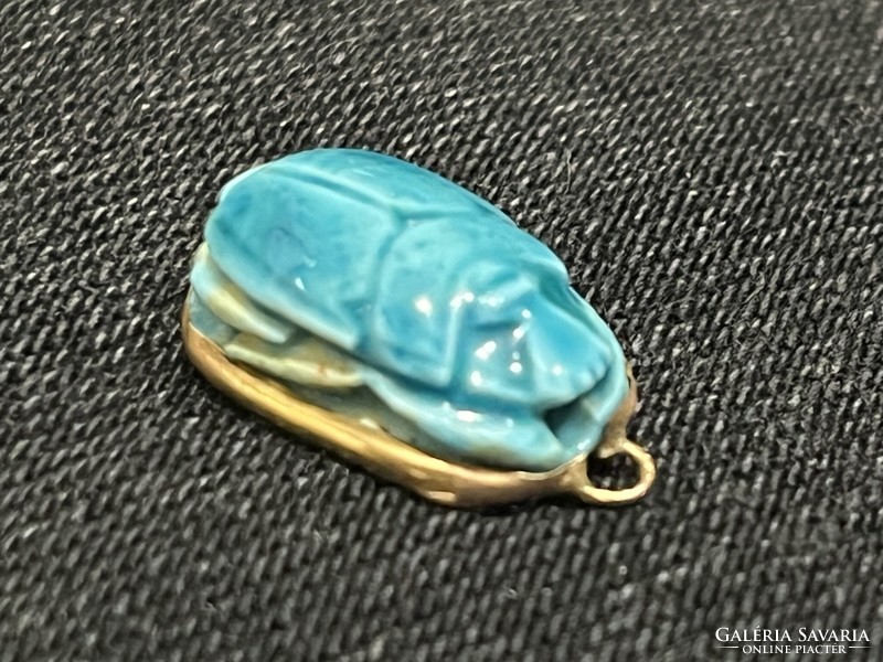 Gold pendant with turquoise stone