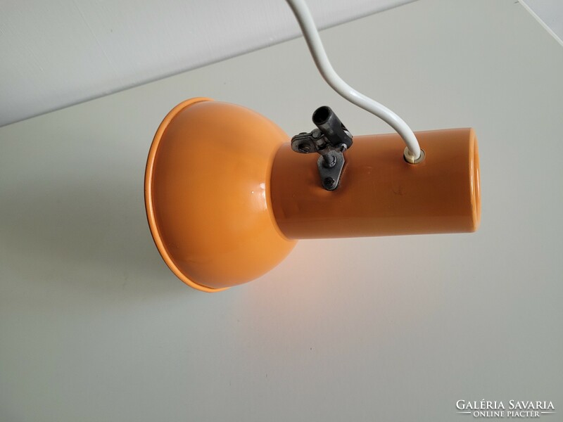 Orange colored old retro long arm adjustable desk lamp mid century