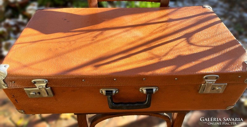 Old metal buckled, large, brown suitcase with manufacturer's mark, retro suitcase