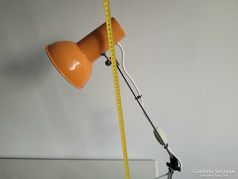 Orange colored old retro long arm adjustable desk lamp mid century