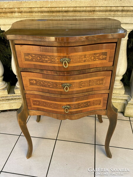 Old graceful three-drawer chest of drawers