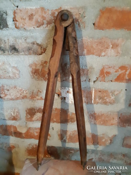 Very old pointed wooden compass, carpenter's or cooper's compass