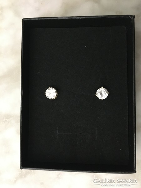 White gold earrings with a large zircon stone