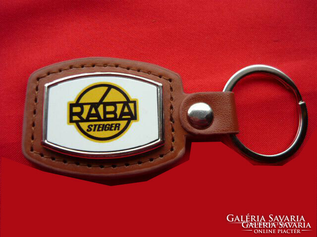 Rába steiger metal keychain on a leather background