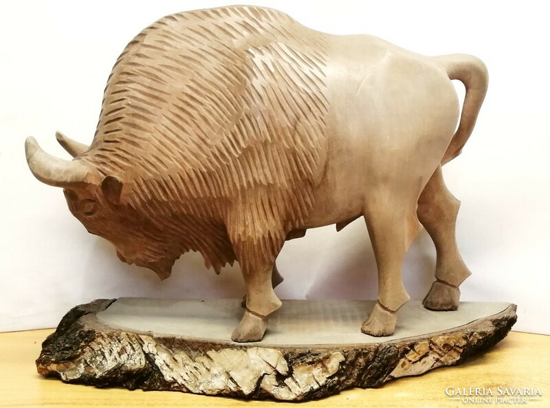 Fisting bison, full-figure carved natural wooden statue in impeccable condition