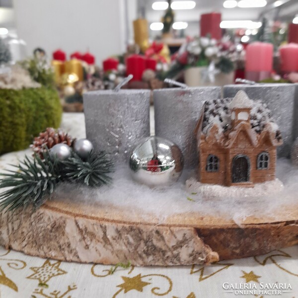 Advent decoration with a house in silvery colors