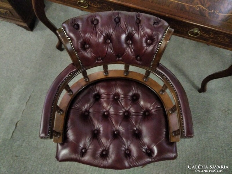 New condition chesterfield captain's chair covered with real leather, leather swivel chair