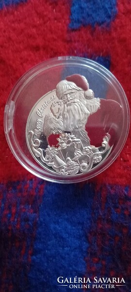 Christmas (Santa Claus) coin in a capsule