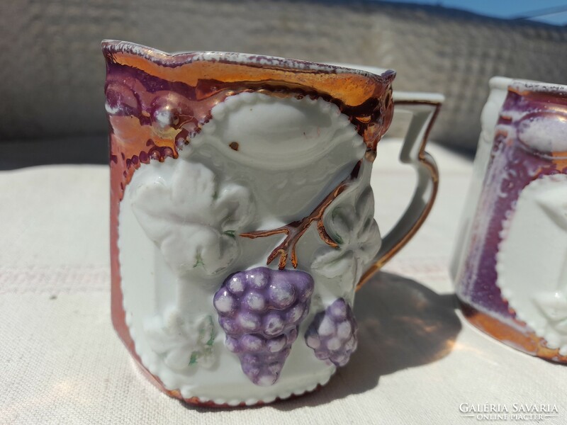 Art nouveau porcelain mug with grape relief pattern