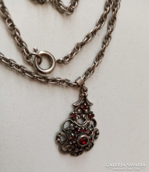 Old silver-plated twisted necklace with a pendant studded with openwork pattern red stones