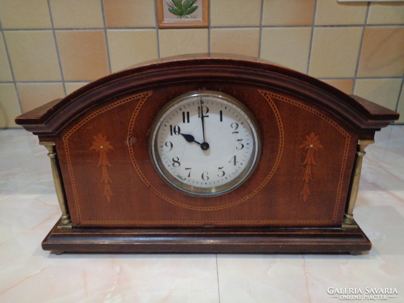 Antique clock in a wooden case