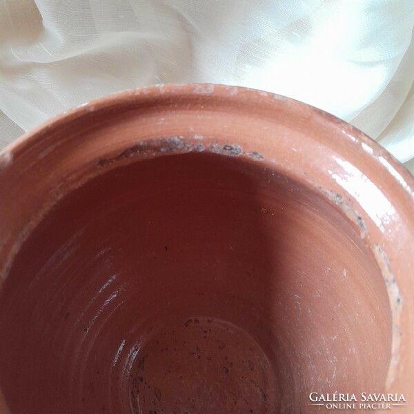 Ceramic glazed jug with a flower motif