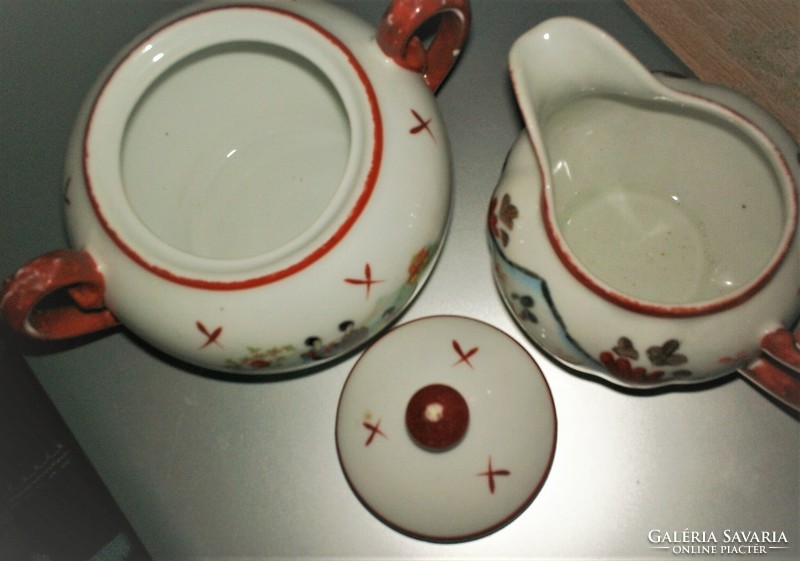 Oriental porcelain sugar holder and pouring in a pair