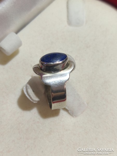 Silver ring with a lapis lazuli stone in a plate setting